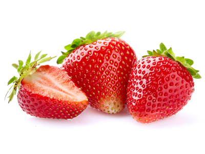Strawberries in closeup on white background